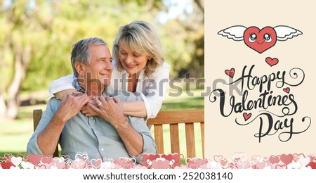 Senior woman hugging her husband who is on the bench against happy valentines day
