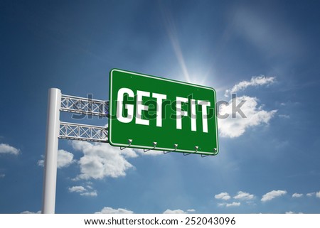 The word get fit and green billboard sign against cloudy sky with sunshine