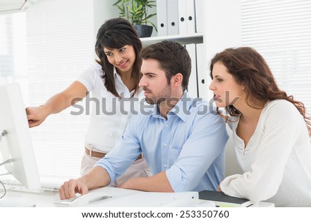 Concentrated teamwork using computer monitor in the office