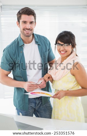 Portrait of smiling designer with her client in the office
