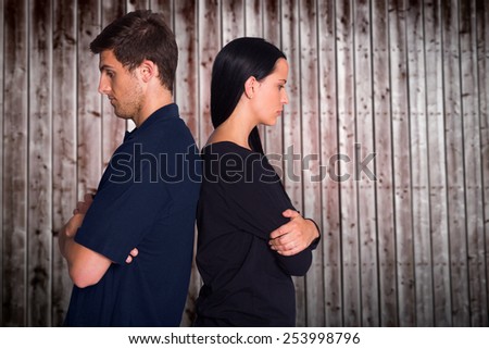 Couple not talking after argument against wooden planks