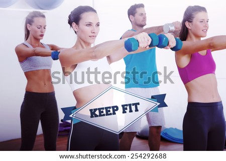 The word keep fit and class exercising with dumbbells in gym against badge