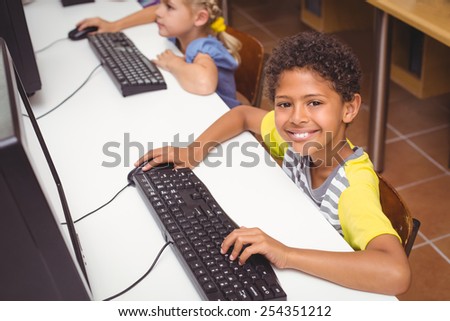 Cute pupils in computer class at the elementary school