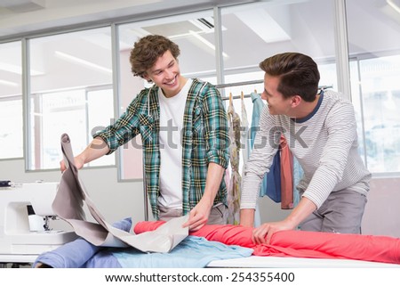 Students working together with a fabric at the college