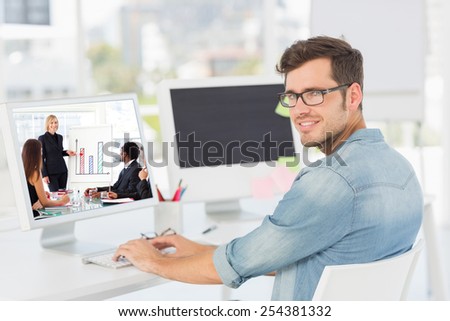Businesswoman reporting to sales in a seminar against side view portrait of a male artist using computer