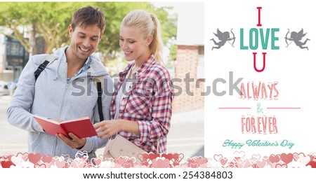 Young tourist couple consulting the guide book against i love you message