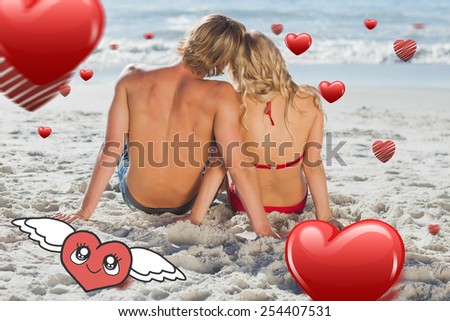 Couple sitting back to camera against heart with wings