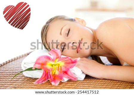 Portrait of a cute woman having a massage against red heart