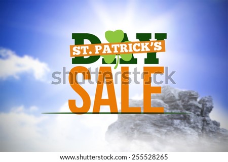 patricks day sale ad against large rock overlooking bright sky