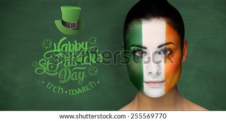 Brunette in irish face paint against green chalkboard