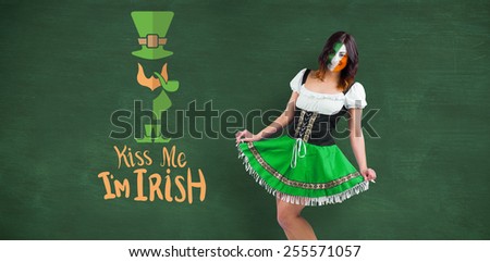 Irish girl smiling against green chalkboard
