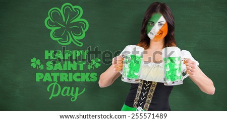 Irish girl with beer against green chalkboard