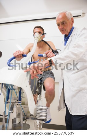 Doctor with man doing fitness test at the medical centre