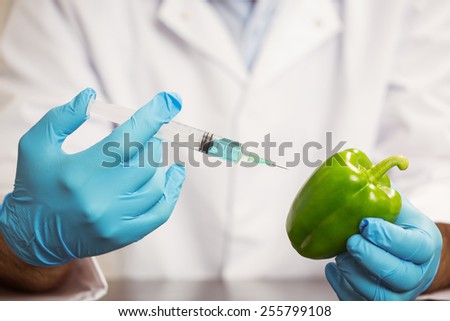 Food scientist injecting a pepper at the university