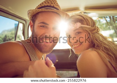 Hipster couple on road trip on a summers day