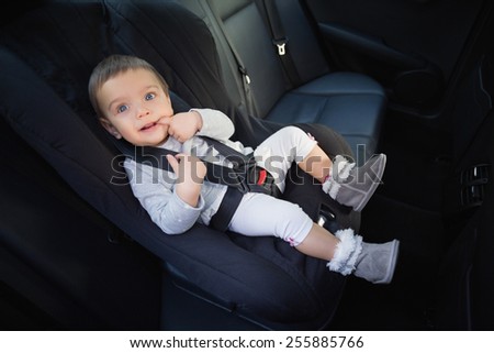 Cute baby in a car seat in the car