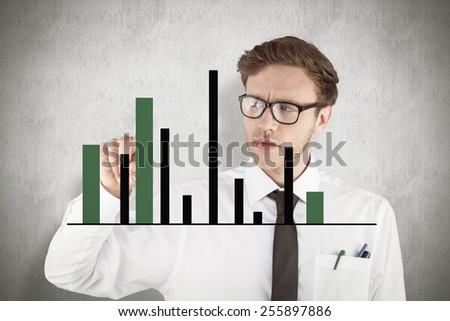 Geeky businessman smiling and pointing against white background
