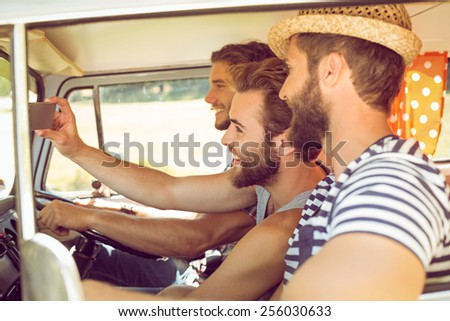 Hipster friends on road trip on a summers day