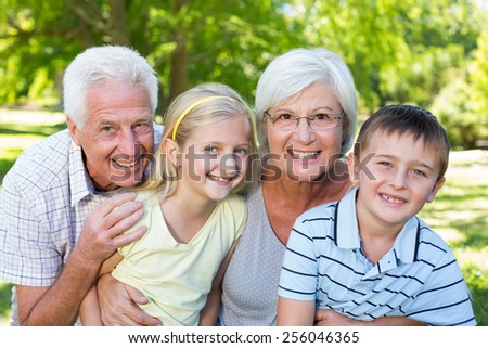 Grandparents and grandchildren in the park on a sunny day