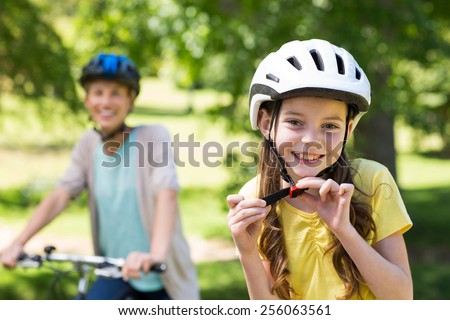 Mother and daughter on their bike on a sunny day