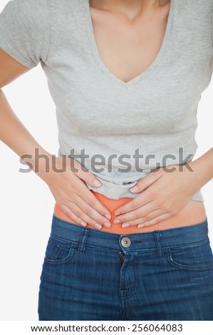 Woman with abdominal pain over white background