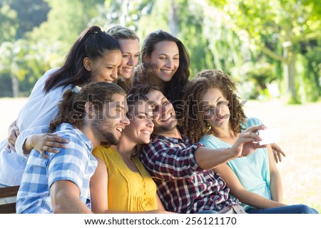 Smiling friends taking a selfie on a sunny day