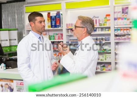 Team of pharmacist speaking together in the pharmacy
