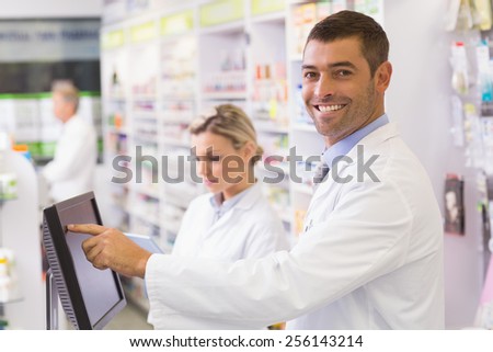 Team of pharmacists using computer at the hospital pharmacy