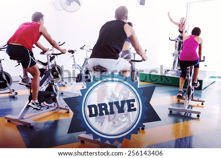 The word drive and spin class working out with motivational instructor against badge