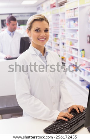 Pharmacist using the computer at the hospital pharmacy
