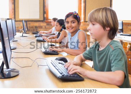 Cute pupils in computer class at the elementary school
