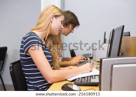 Students working together on computer at the university