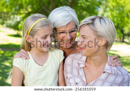 Happy blonde with her daughter and grandmother on a sunny day
