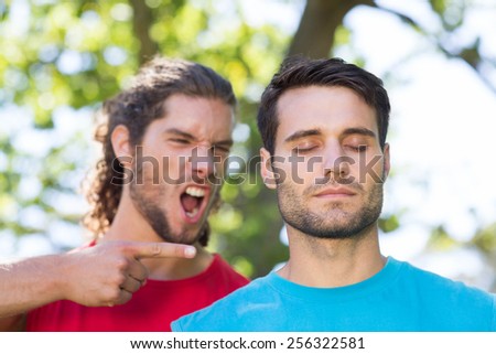 Tough trainer shouting at his client on a sunny day