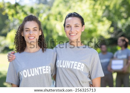 Happy volunteers in the park on a sunny day