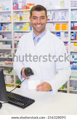 Pharmacist looking at camera at the hospital pharmacy