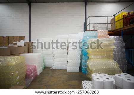 Close up of plastic packaging and paper roll in a large warehouse