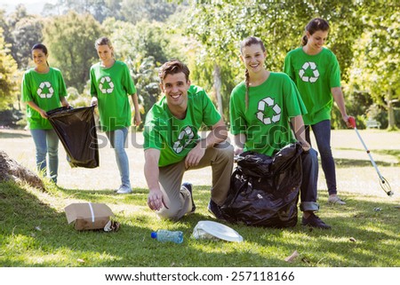 Environmental activists picking up trash on a sunny day