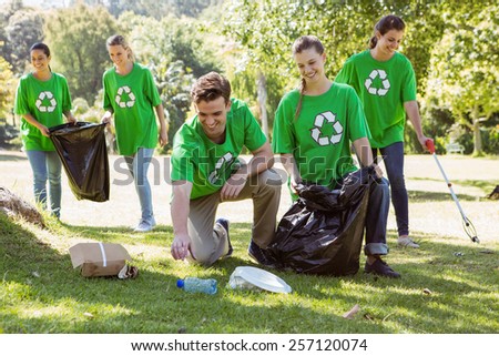 Environmental activists picking up trash on a sunny day