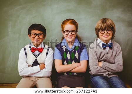 Portrait of smiling little school kids in classroom