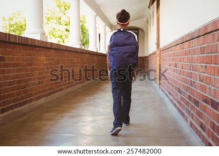 Full length of girl walking in school corridor