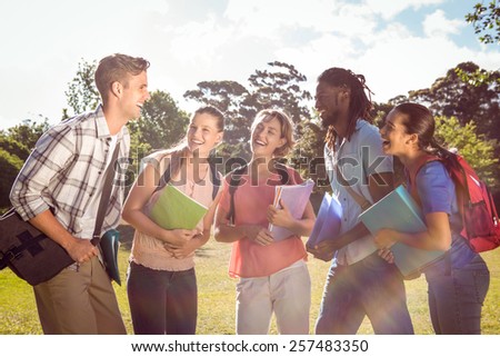 Happy students outside on campus on a sunny day