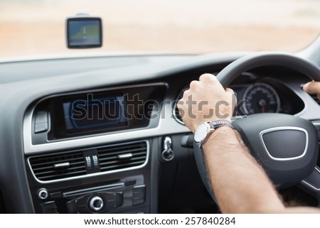 Man driving with satellite navigation system in his car