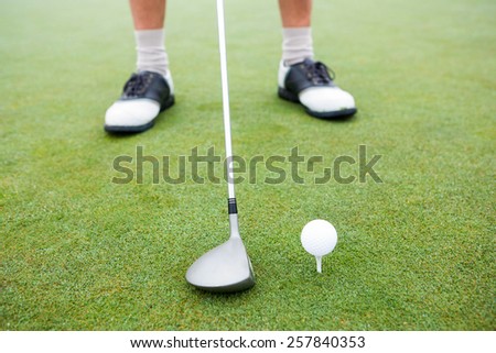 Golfer about to tee off at the golf course