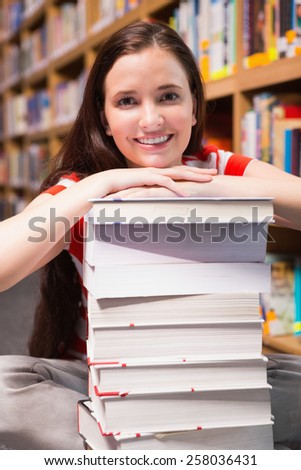 Student sitting on floor in library at the university