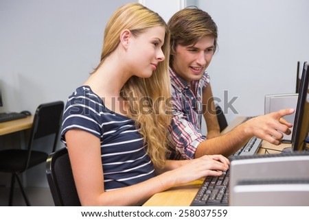 Students working together on computer at the university