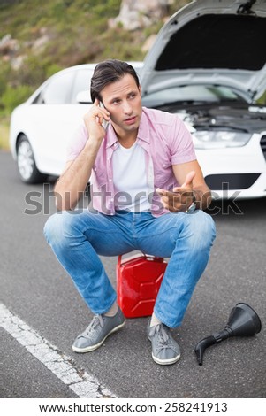 Man after a car breakdown at the side of the road