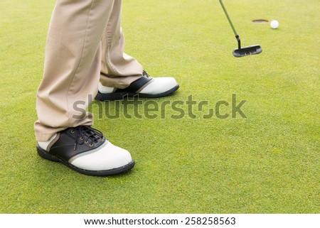Golfer about to tee off at the golf course