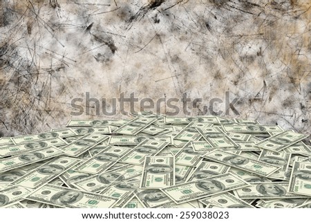 Pile of dollars against dark background