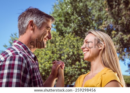 Happy couple in the park on a sunny day